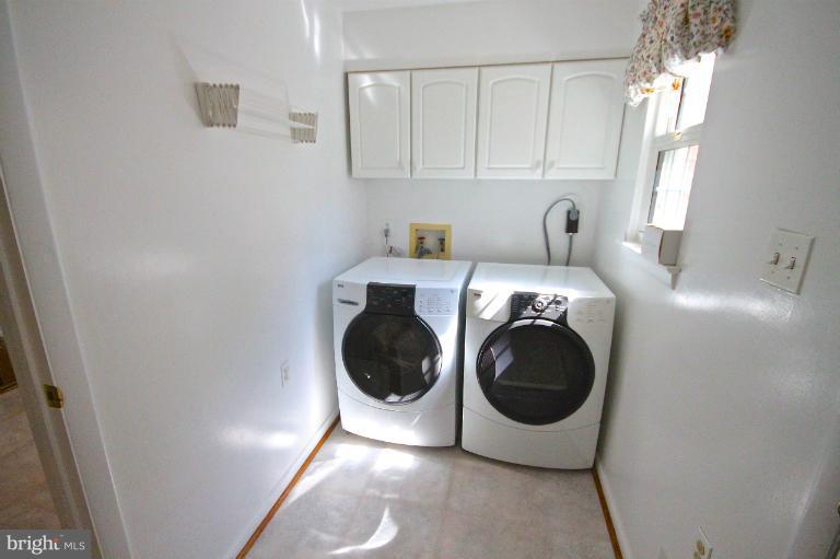 13007 Middlevale Lane Silver Spring, MD 20906 - Photo 11 of 30 a utility room with dryer and washer