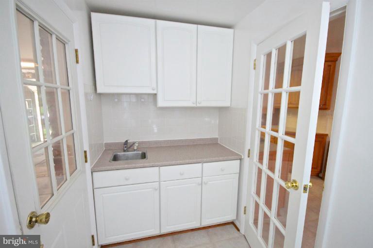 13007 Middlevale Lane Silver Spring, MD 20906 - Photo 12 of 30 a kitchen with a sink and cabinets