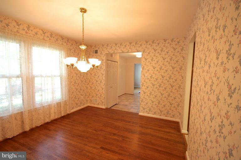 13007 Middlevale Lane Silver Spring, MD 20906 - Photo 13 of 30 a view of a room with wooden floor and a window