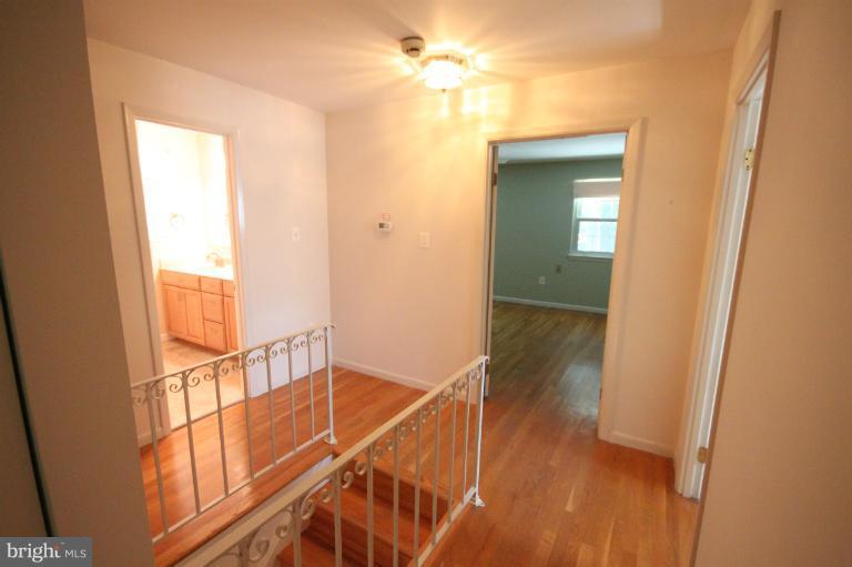 13007 Middlevale Lane Silver Spring, MD 20906 - Photo 16 of 30 a view of a hallway with a window