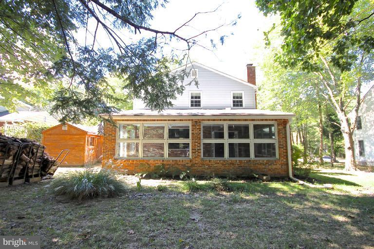 13007 Middlevale Lane Silver Spring, MD 20906 - Photo 21 of 30 front view of a house with a yard