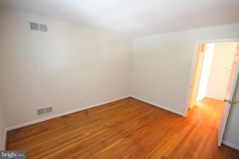 13007 Middlevale Lane Silver Spring, MD 20906 - Photo 27 of 30 a view of empty room with wooden floor