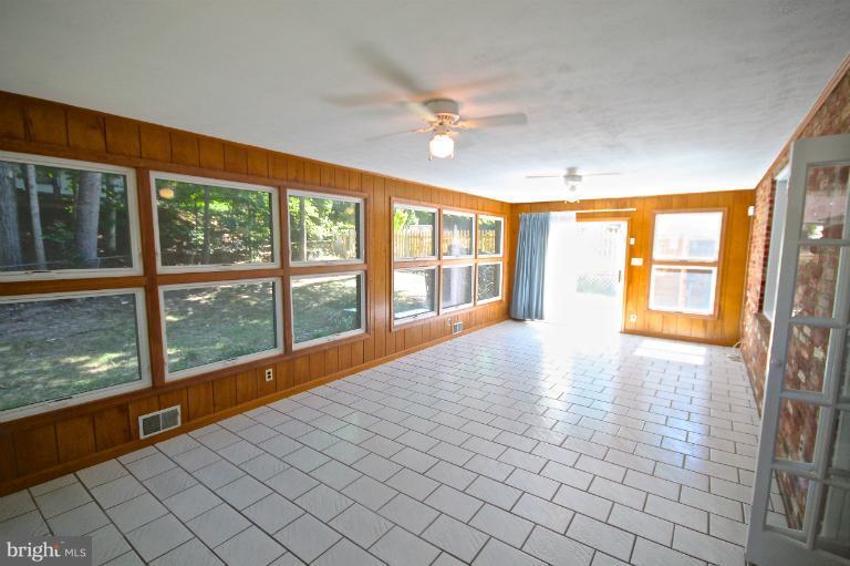 13007 Middlevale Lane Silver Spring, MD 20906 - Photo 5 of 30 a view of an entryway with wooden floor and windows