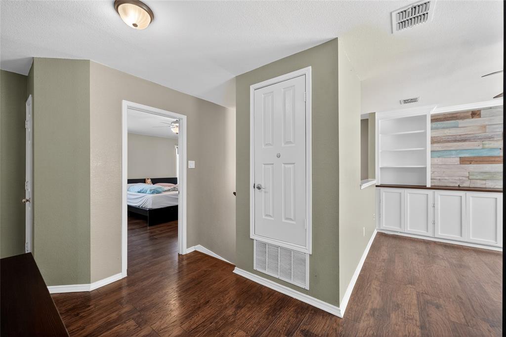 9633 Anns Way Plano, TX 75025 - Photo 23 of 37 a view of a room with wooden floor and bathroom