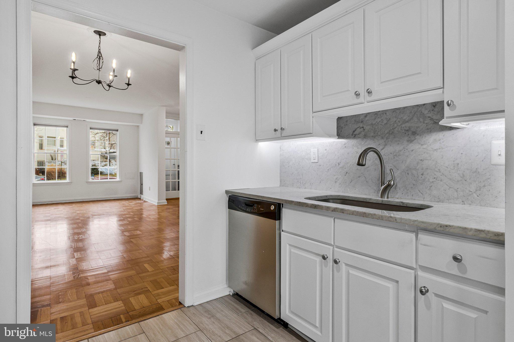 123 E Street Southeast Washington, DC 20003 - Photo 14 of 42 a kitchen with stainless steel appliances granite countertop white cabinets and a sink