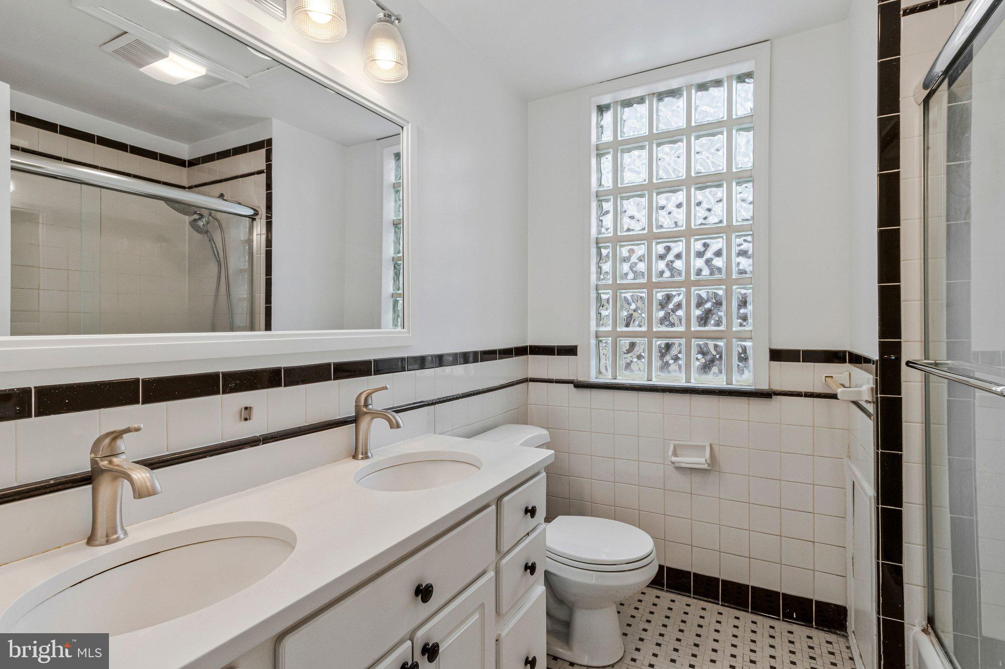 123 E Street Southeast Washington, DC 20003 - Photo 21 of 42 a bathroom with a sink toilet and shower