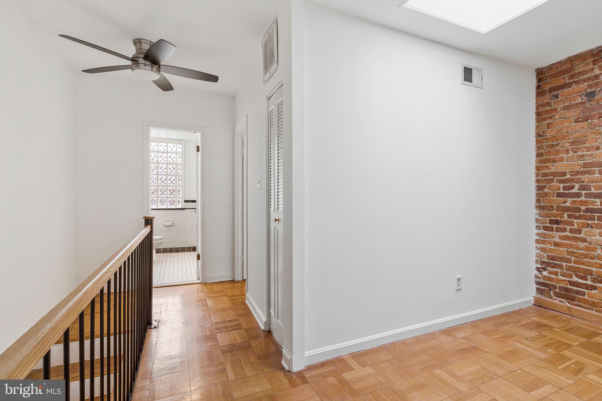 123 E Street Southeast Washington, DC 20003 - Photo 30 of 42 a view of a hallway with a chandelier fan and entryway