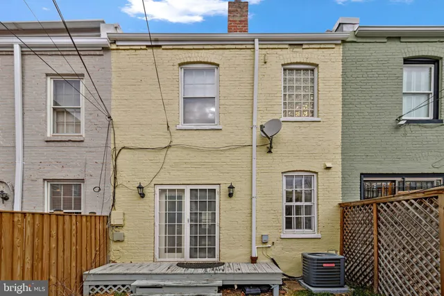 a view of a white house with a large windows