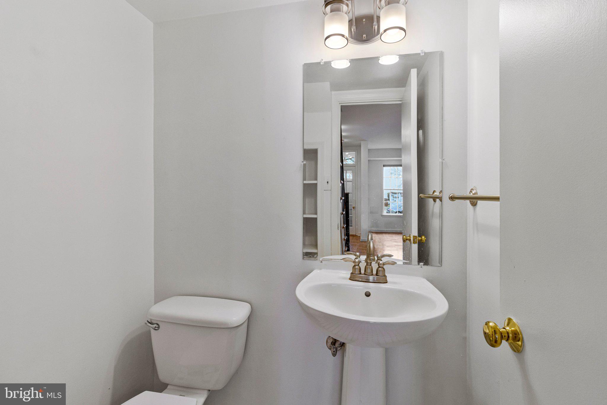 123 E Street Southeast Washington, DC 20003 - Photo 5 of 42 a bathroom with a sink and a mirror