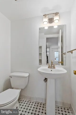 a view of a livingroom with wooden floor and stairs