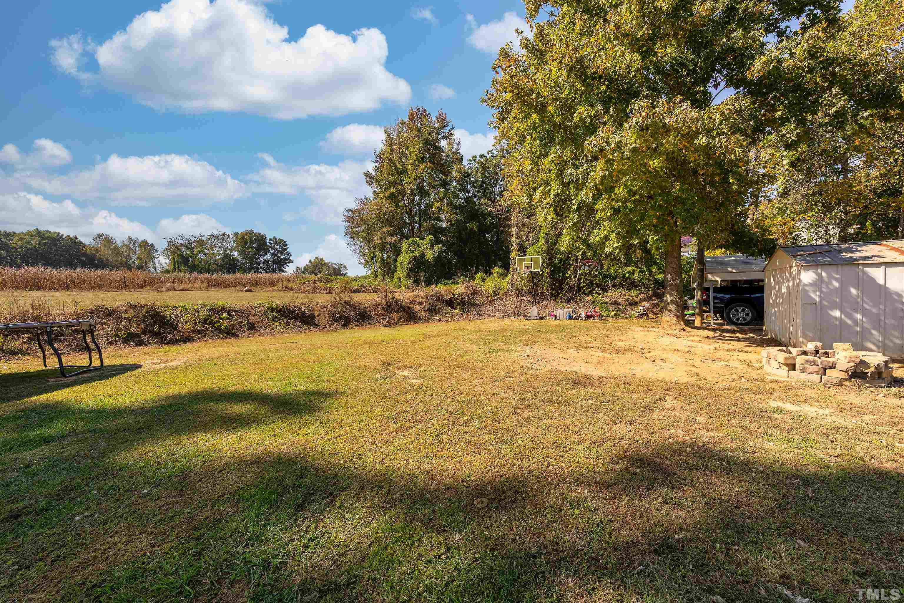 1469 Semora Road Roxboro, NC 27574 - Photo 19 of 22 a view of a yard with an outdoor space