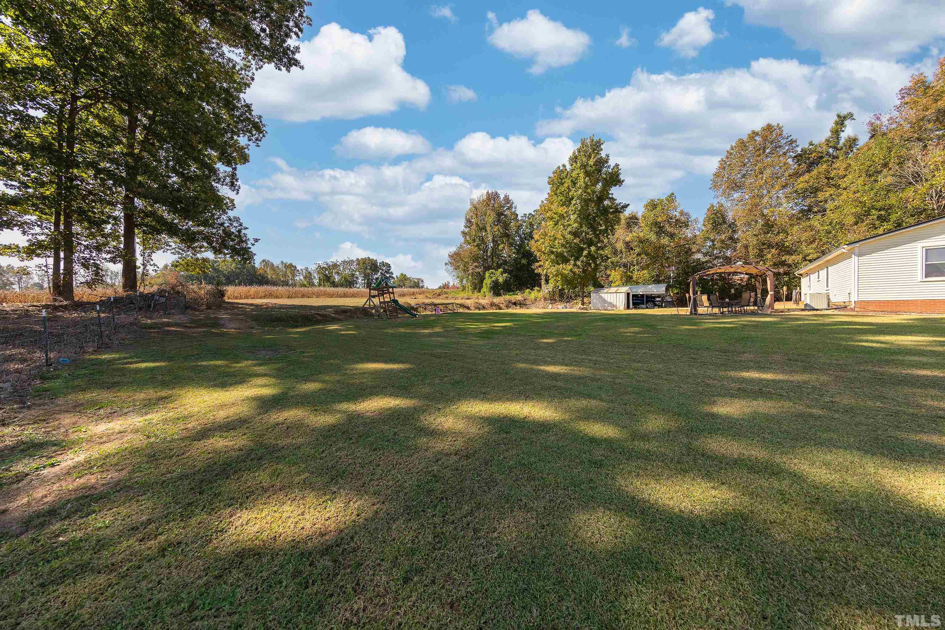 1469 Semora Road Roxboro, NC 27574 - Photo 20 of 22 a view of a yard in front of the house