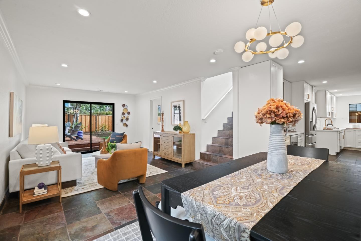 148 Myrtle Street Santa Cruz, CA 95060 - Photo 13 of 45 a living room with dining table furniture and a chandelier