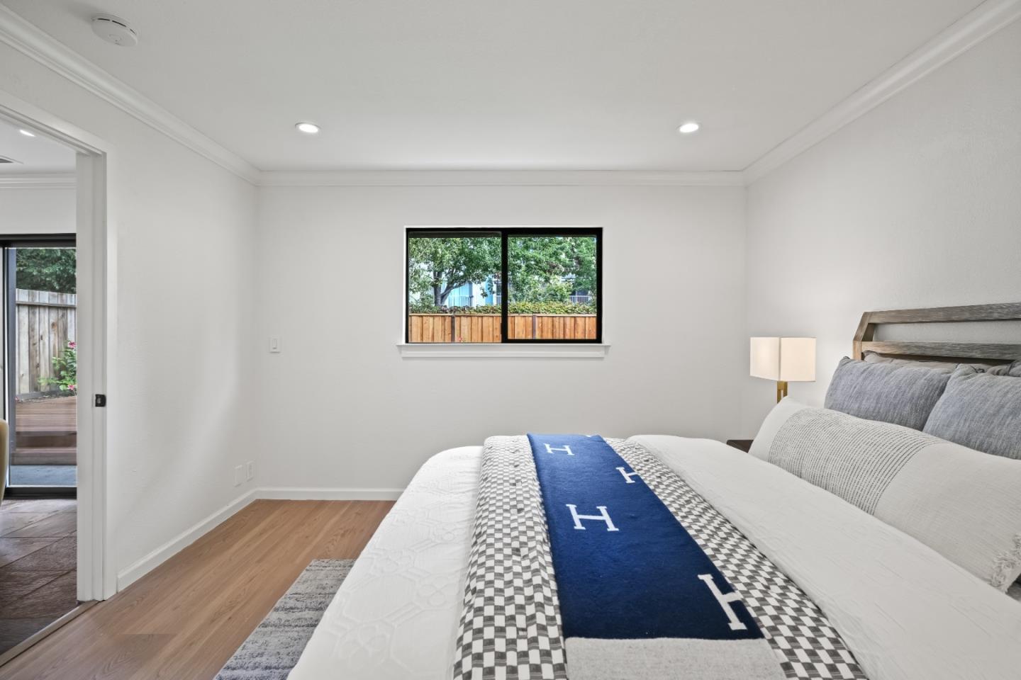 148 Myrtle Street Santa Cruz, CA 95060 - Photo 17 of 45 a bedroom with a large bed and a window