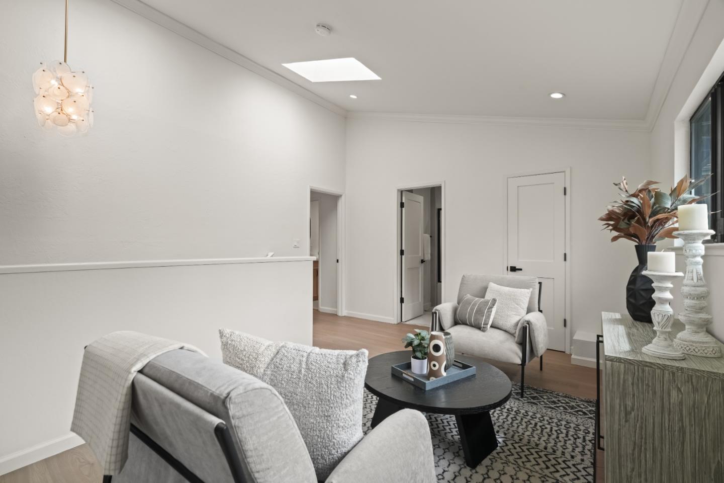 148 Myrtle Street Santa Cruz, CA 95060 - Photo 21 of 45 a living room with furniture and a chandelier