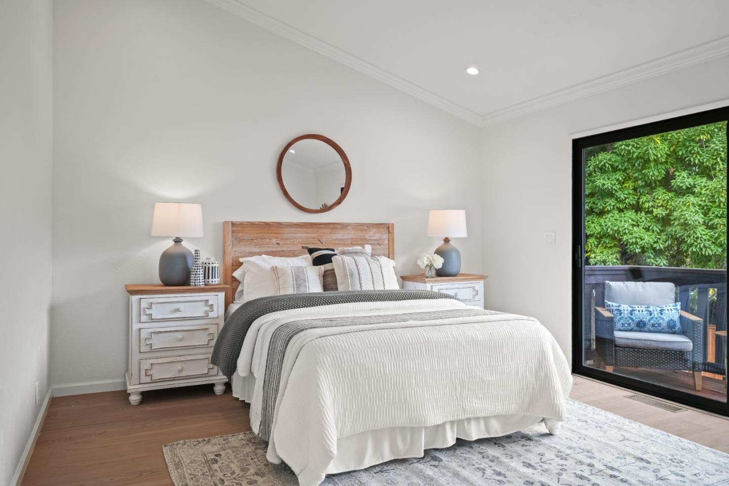 148 Myrtle Street Santa Cruz, CA 95060 - Photo 23 of 45 a bedroom with a bed and wooden floor