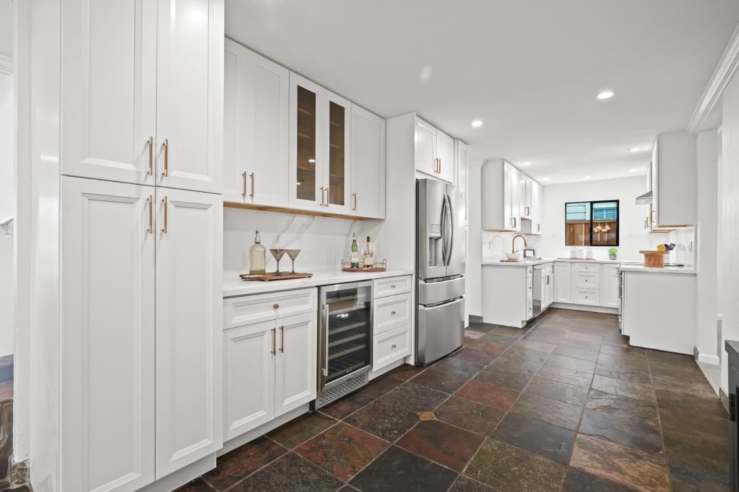 148 Myrtle Street Santa Cruz, CA 95060 - Photo 9 of 45 a kitchen with white cabinets and white appliances