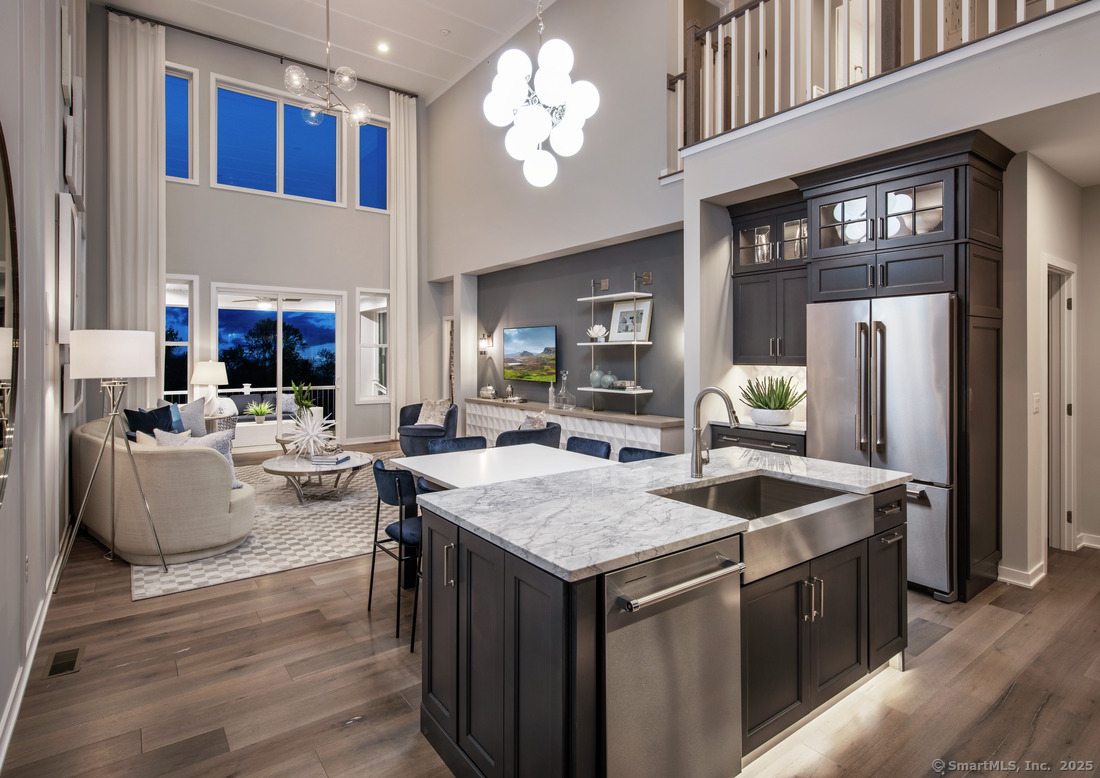 4 Whisper Rdg Way, Unit 41 Woodbridge, CT 06525 - Photo 2 of 12 a kitchen with stainless steel appliances granite countertop a sink and a refrigerator