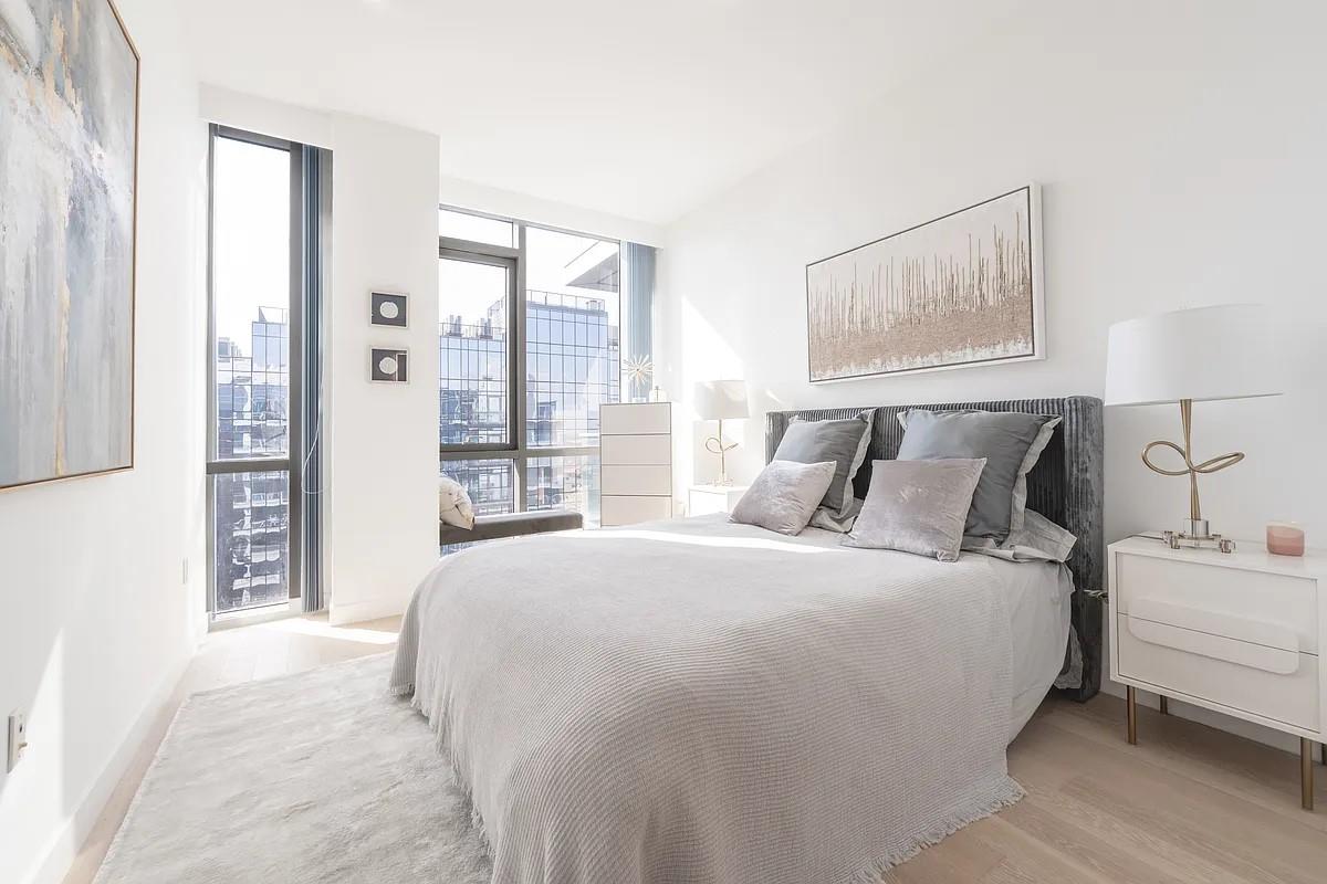 33-66 Farrington Street, Unit 14J Queens, NY 11354 - Photo 7 of 8 Bedroom featuring floor to ceiling windows and light wood-style floors