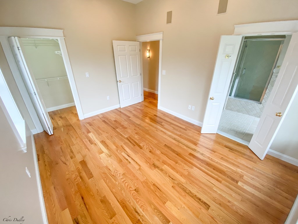 53 Thomas Park, Unit 9 Boston, MA 02127 - Photo 14 of 41 wooden floor with a bathroom