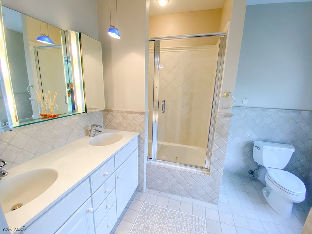 53 Thomas Park, Unit 9 Boston, MA 02127 - Photo 17 of 41 a bathroom with a sink toilet and shower