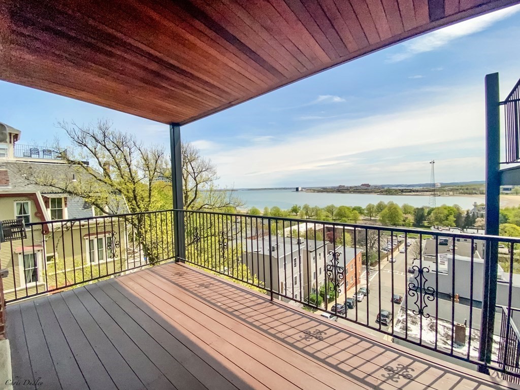53 Thomas Park, Unit 9 Boston, MA 02127 - Photo 25 of 41 a view of balcony with wooden floor