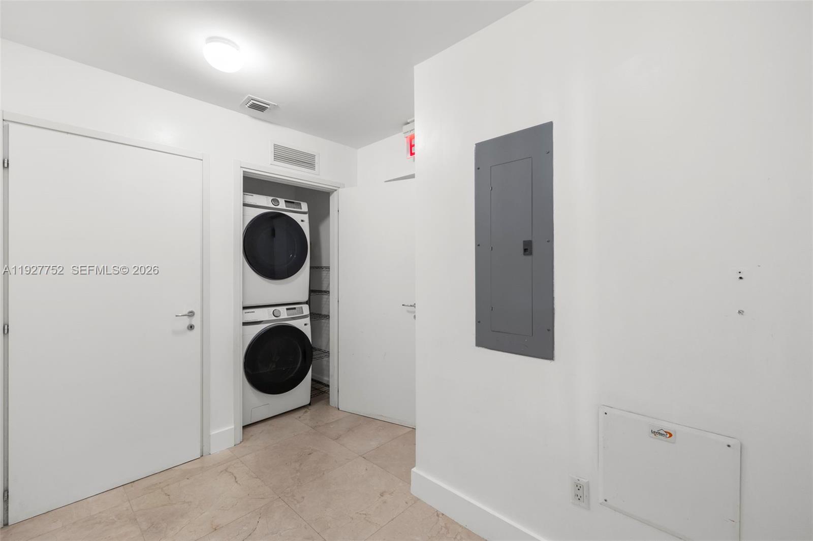 50 South Pointe Drive, Unit 1107 Miami Beach, FL 33139 - Photo 18 of 41 a utility room with dryer and washer