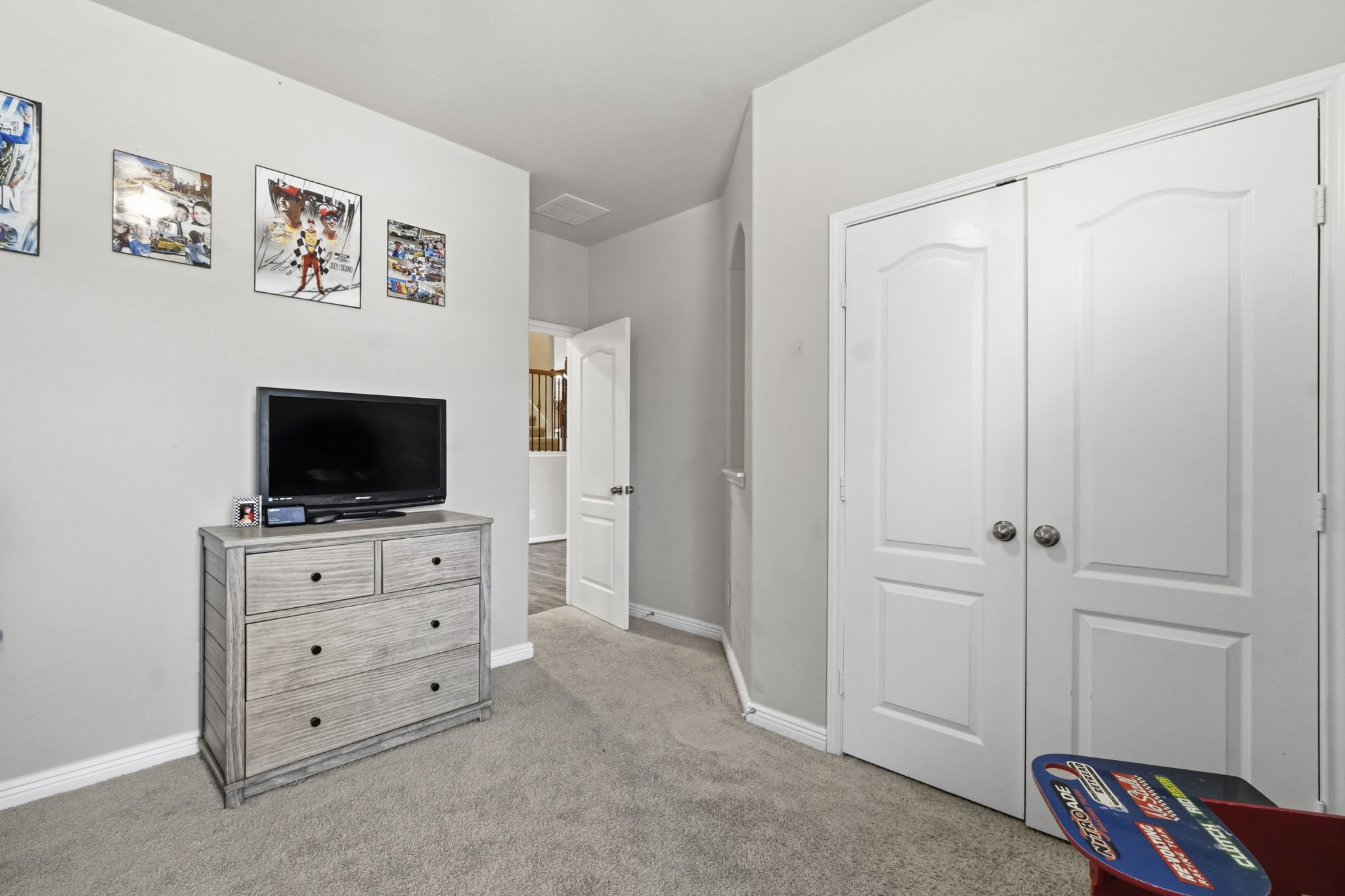 3900 Enchanted Timbers Lane Spring, TX 77386 - Photo 28 of 49 a room with a television and a dresser