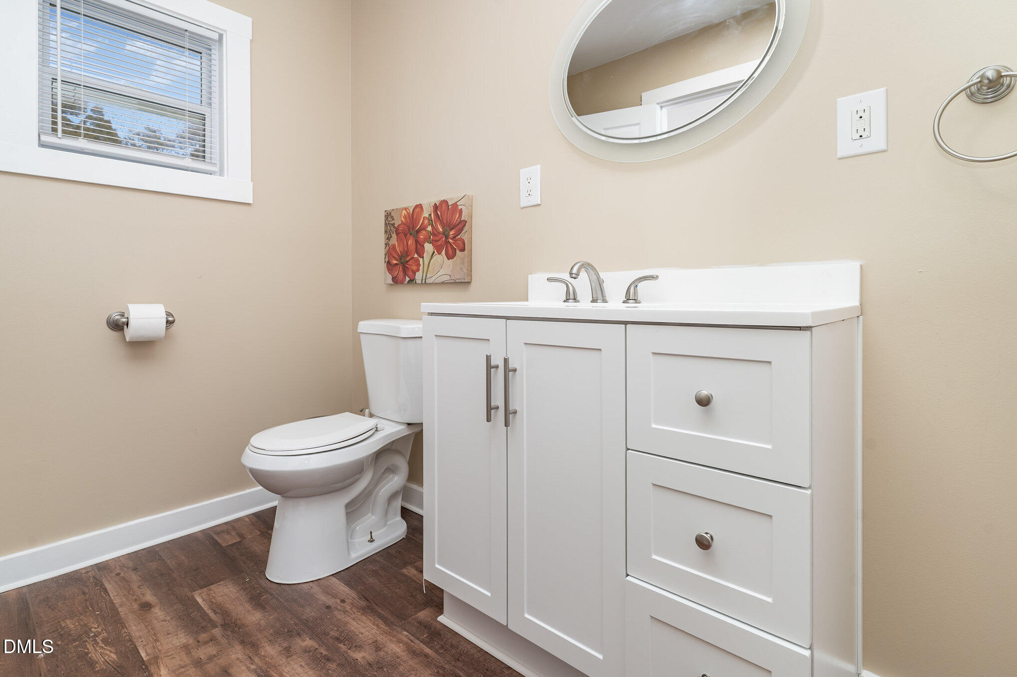 1002 Southerlund Road Garner, NC 27529 - Photo 7 of 12 a bathroom with a toilet and a sink