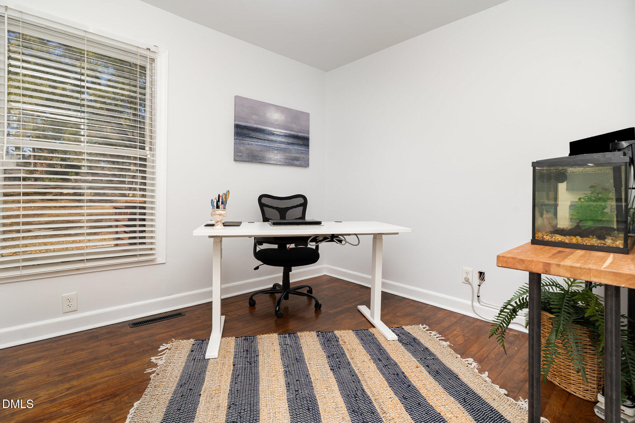 1002 Southerlund Road Garner, NC 27529 - Photo 10 of 12 a view of a workspace with furniture and a window
