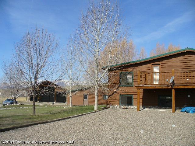 480 Jewell Lane, Unit C R 259 Rifle, CO 81650 - Photo 1 of 12 a front view of a house with a yard