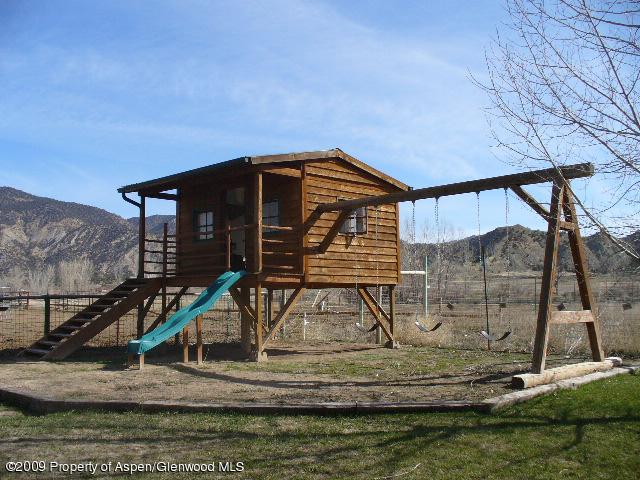 480 Jewell Lane, Unit C R 259 Rifle, CO 81650 - Photo 11 of 12 a front view of a house with a yard