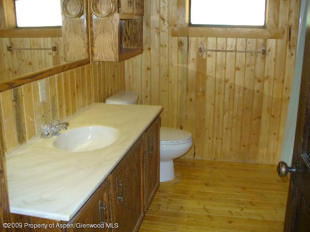 480 Jewell Lane, Unit C R 259 Rifle, CO 81650 - Photo 10 of 12 a bathroom with a sink and a mirror