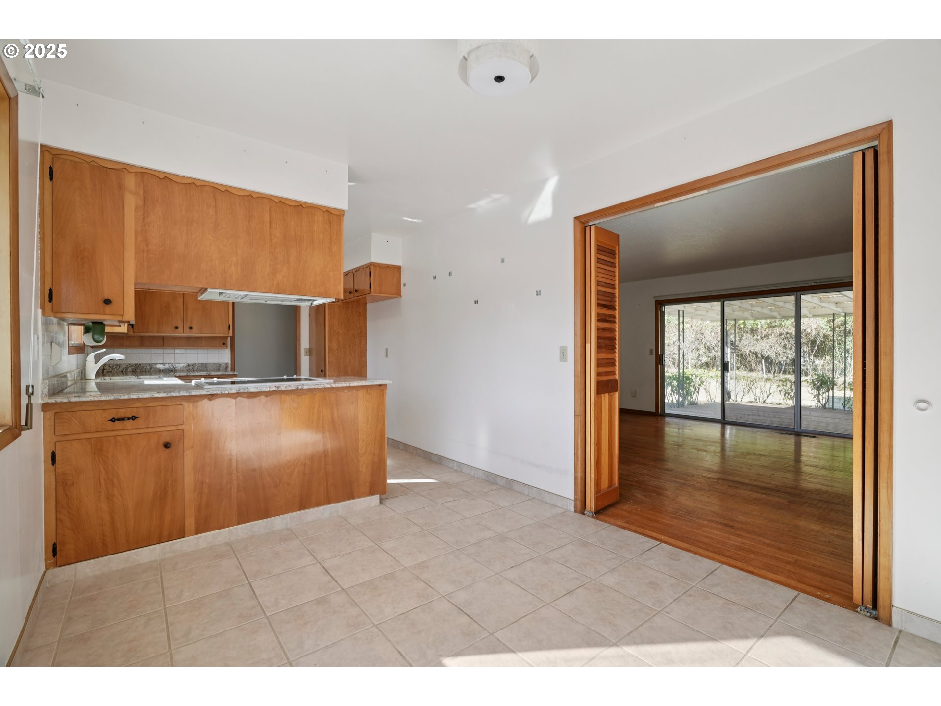 1727 Northeast 153rd Place Portland, OR 97230 - Photo 11 of 37 a kitchen with stainless steel appliances granite countertop a stove a sink and a refrigerator