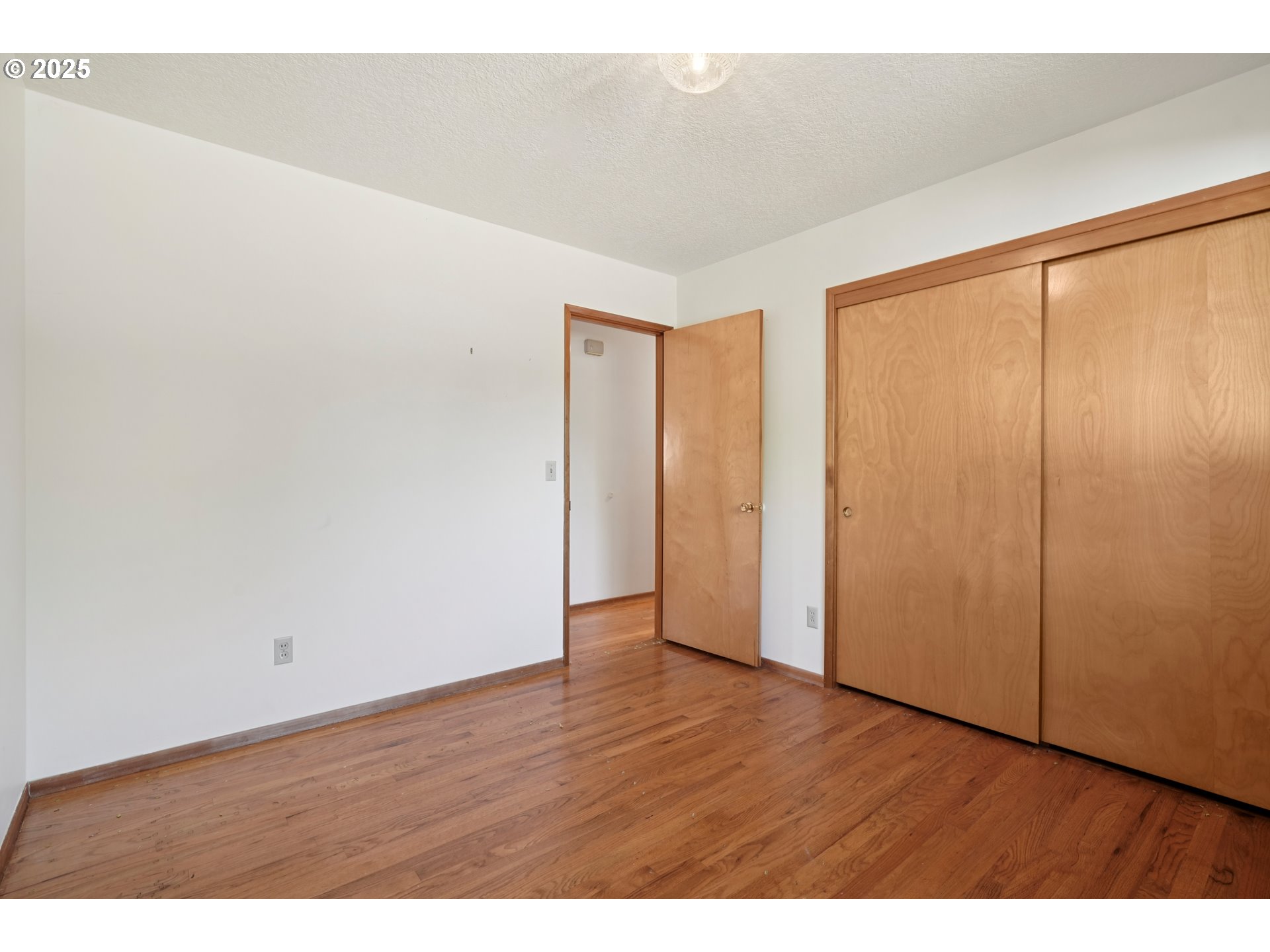 1727 Northeast 153rd Place Portland, OR 97230 - Photo 19 of 37 a view of an empty room with wooden floor
