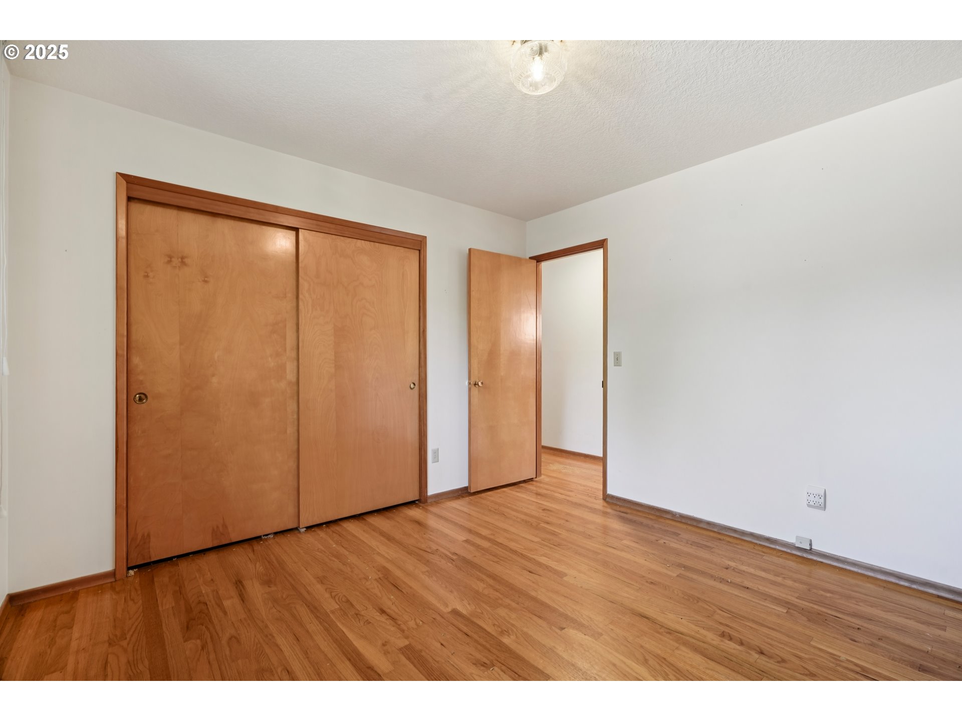 1727 Northeast 153rd Place Portland, OR 97230 - Photo 20 of 37 a view of an empty room with wooden floor