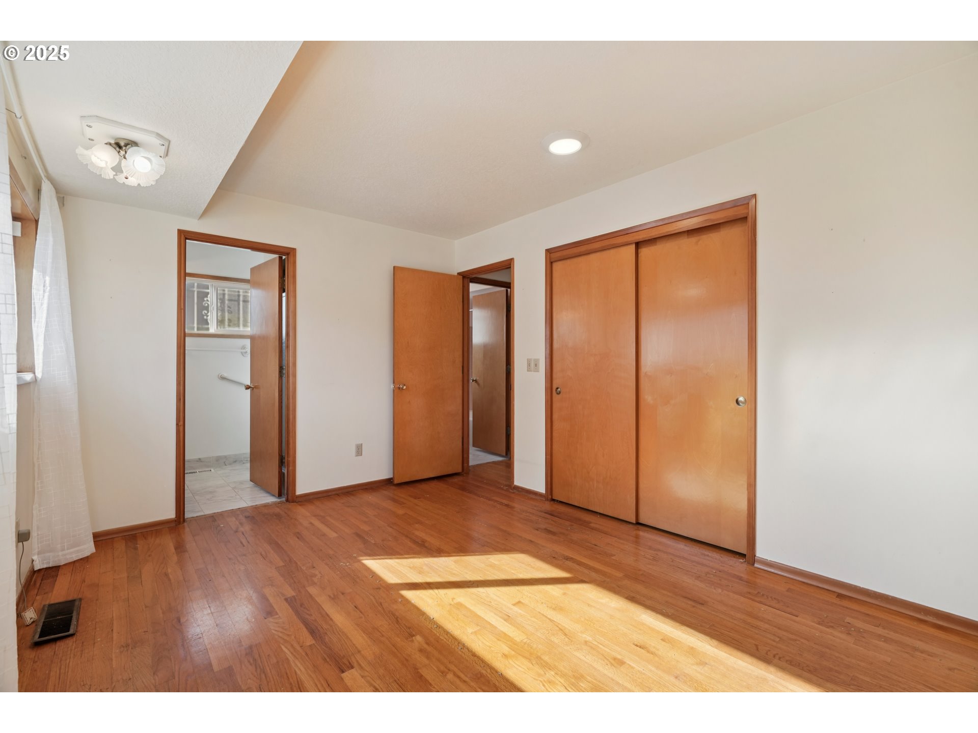 1727 Northeast 153rd Place Portland, OR 97230 - Photo 25 of 37 a view of an empty room with wooden floor
