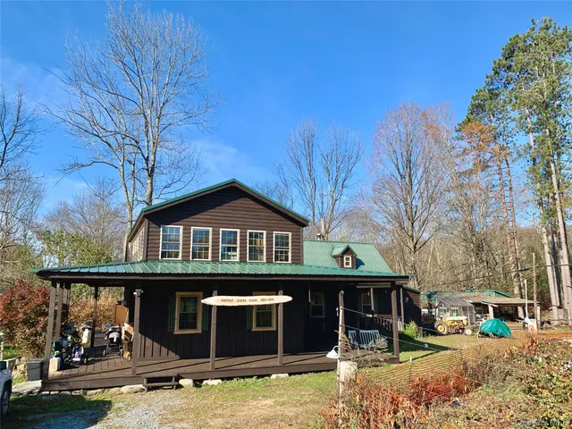 a view of porch with wooden floor