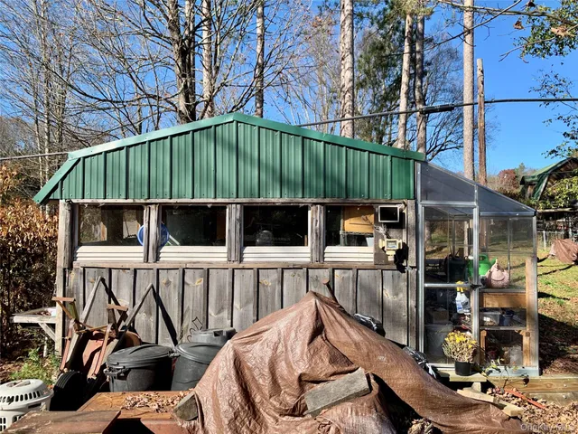 a kitchen with a stove a refrigerator and a dining table
