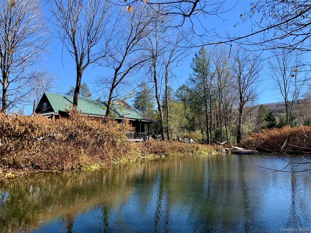 a view of a balcony with wooden floor and outdoor space