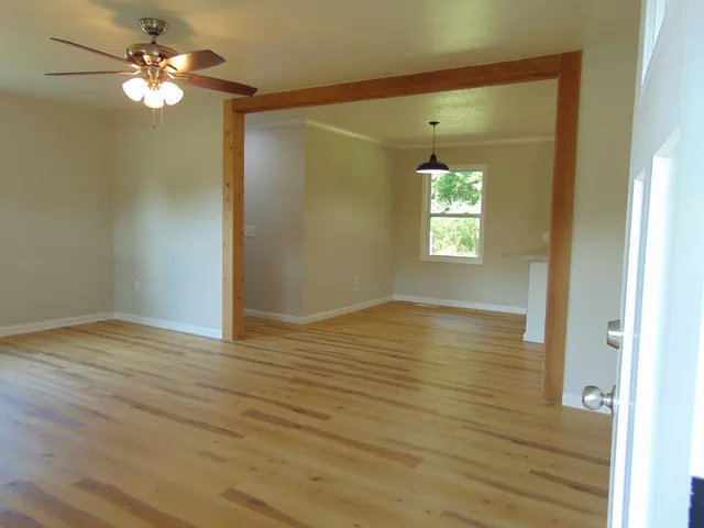 a view of room window and wooden floor