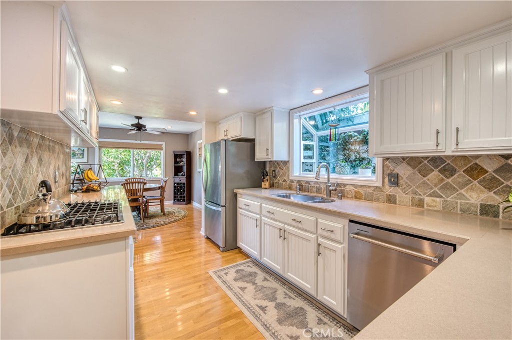 34052 Crystal Lantern Dana Point, CA 92629 - Photo 13 of 42 a kitchen with stainless steel appliances granite countertop a sink stove and refrigerator