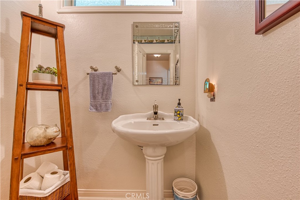 34052 Crystal Lantern Dana Point, CA 92629 - Photo 15 of 42 a bathroom with a sink and a mirror