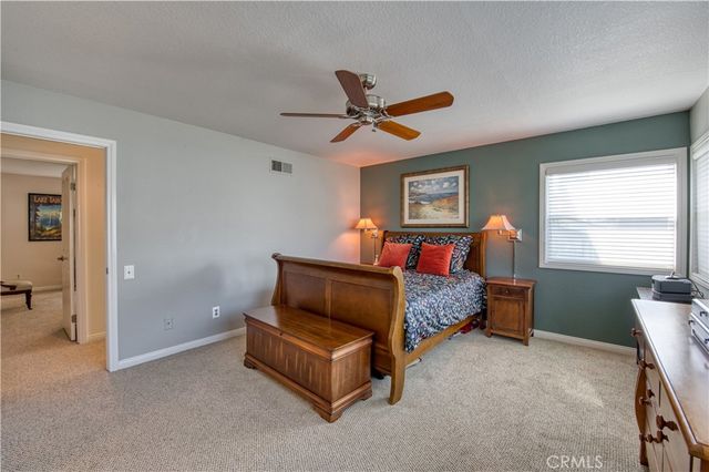 a bed room with a bed and a window