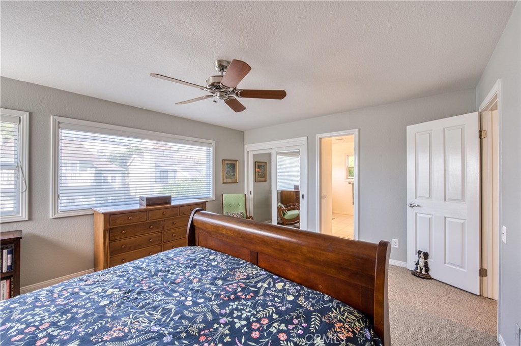 34052 Crystal Lantern Dana Point, CA 92629 - Photo 21 of 42 a bed room with a bed and a large window
