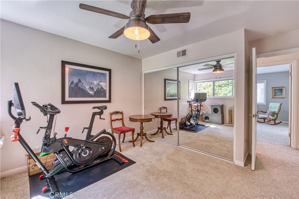 34052 Crystal Lantern Dana Point, CA 92629 - Photo 27 of 42 a living room with furniture a flat screen tv and a ceiling fan