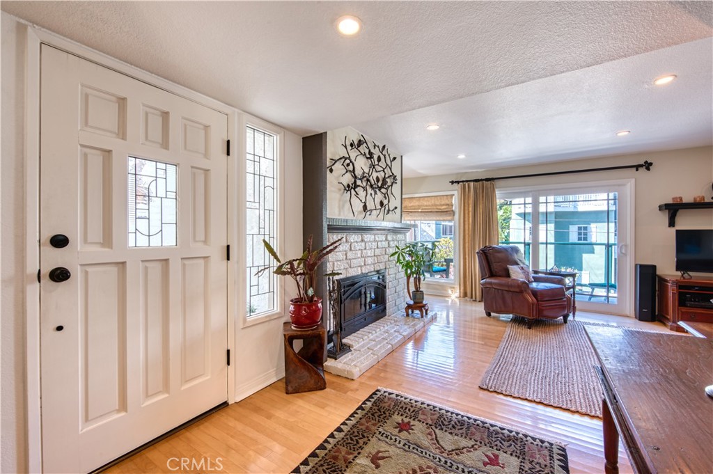 34052 Crystal Lantern Dana Point, CA 92629 - Photo 3 of 42 a living room with furniture and a fireplace