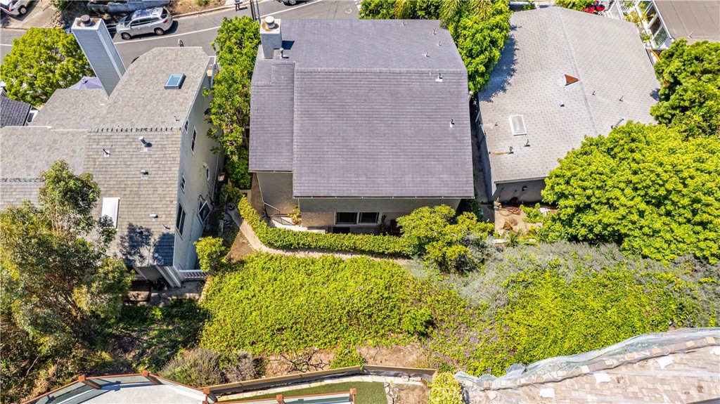 34052 Crystal Lantern Dana Point, CA 92629 - Photo 33 of 42 an aerial view of a house with a yard and garden