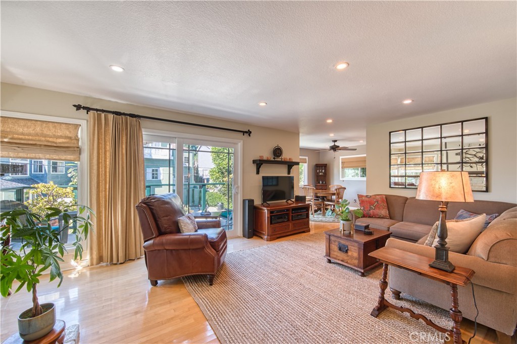 34052 Crystal Lantern Dana Point, CA 92629 - Photo 4 of 42 a living room with furniture flat screen tv and large windows