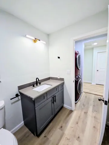a view of a bathroom with a sink and mirror
